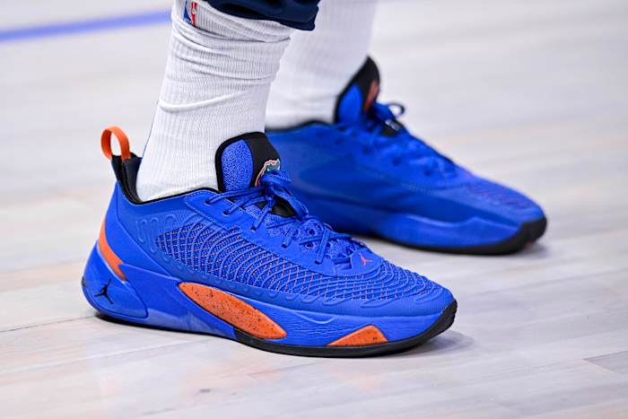 View of blue and orange Jordan Luka shoes.